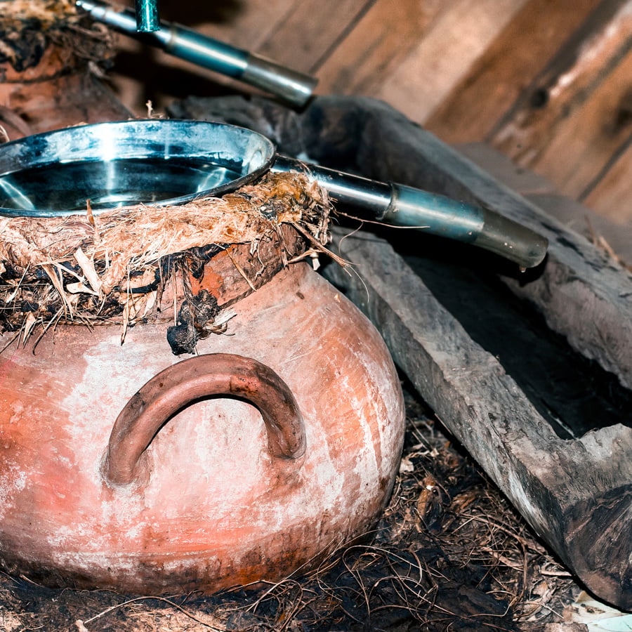 Mezcal artesenal in traditional clay pot still