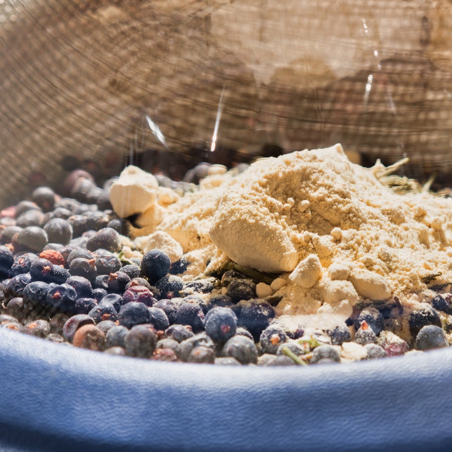 Juniper and other botanicals ready for distillation