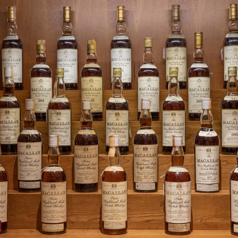 Vintage Macallan single malts in a custom built cabinet