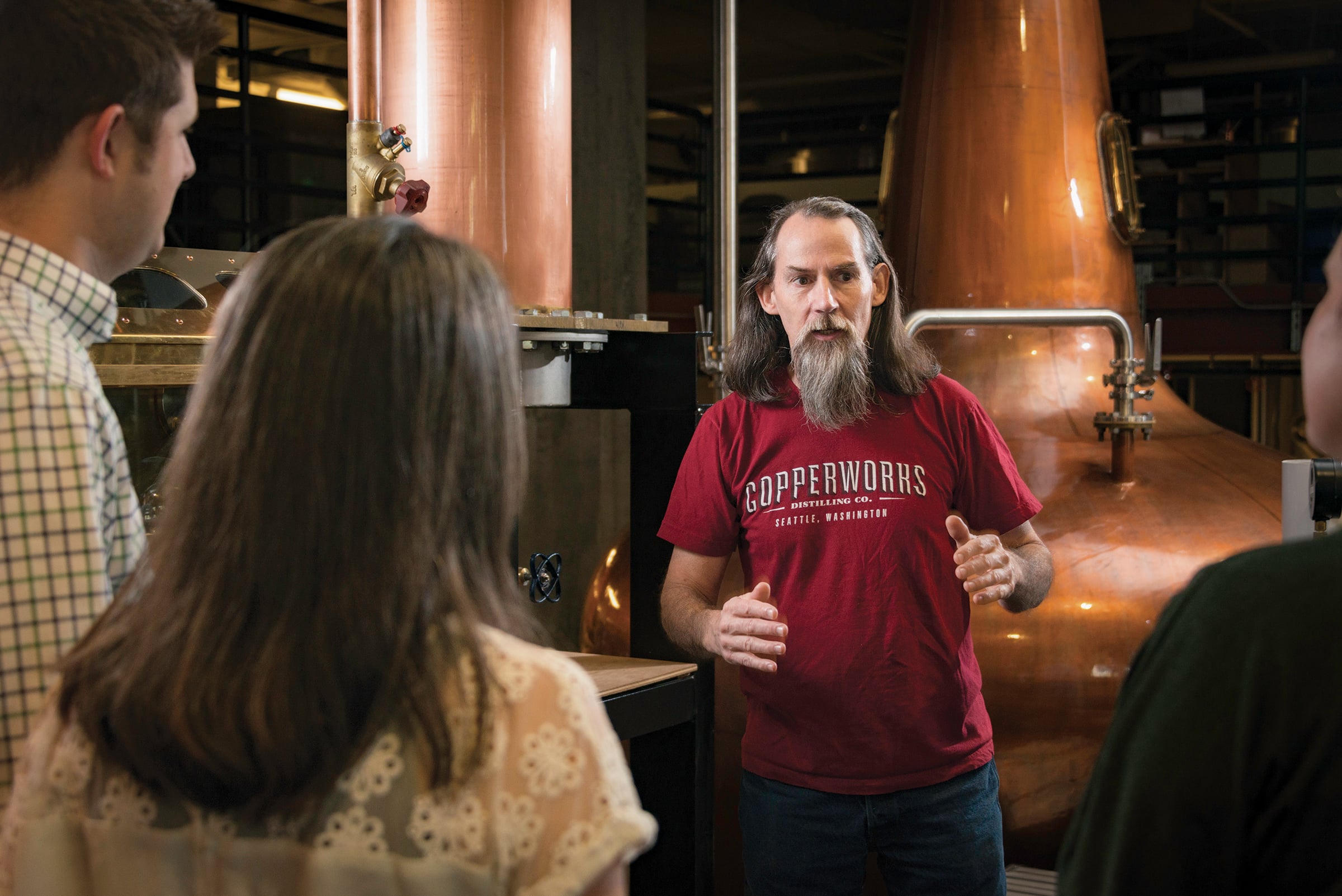 Copperworks distiller Micah Nutt giving a tour