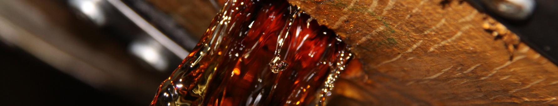 Bourbon pouring from a barrel at Buffalo Trace distillery
