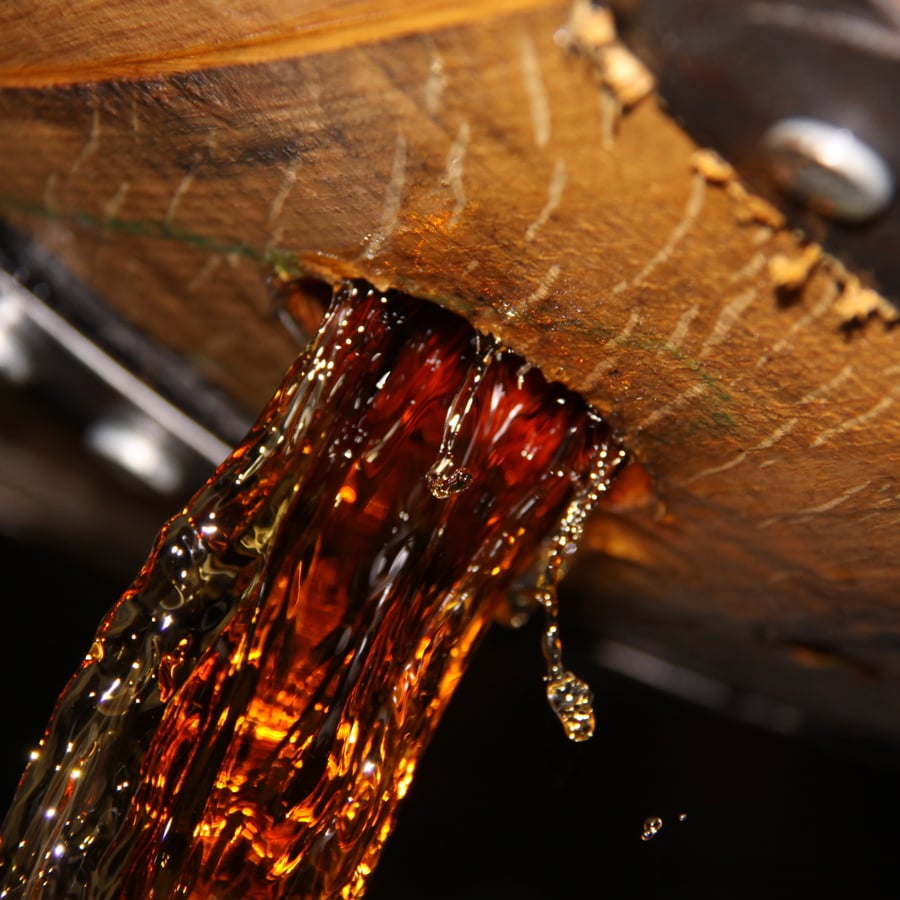 Bourbon pouring from a barrel at Buffalo Trace distillery